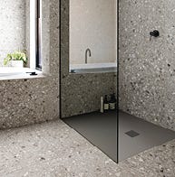 Patterned tile bathroom with slate shower tray 